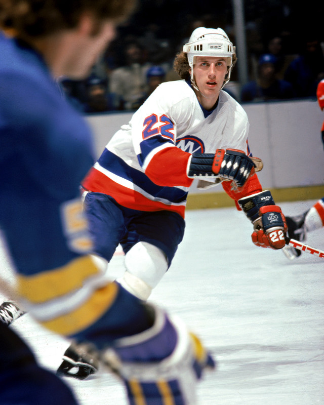 Hockey player moving ice puck #2 free wallpaper for mobile - medium preview image