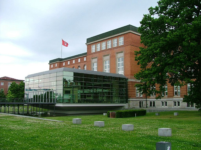 Building flag grassy trees fence free wallpaper for desktop - medium preview image