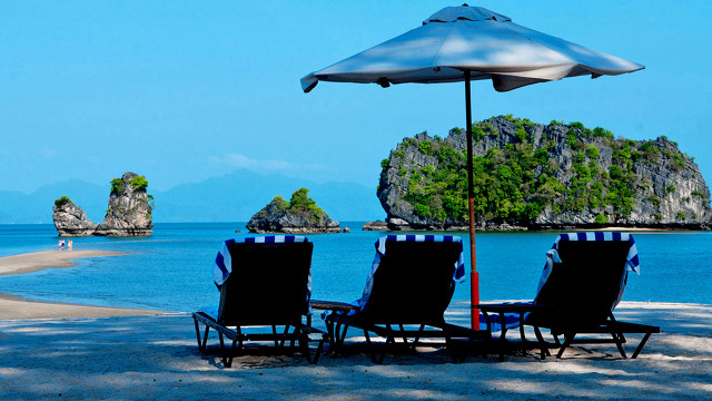 Lawn chairs under umbrella beach free wallpaper for desktop - medium preview image