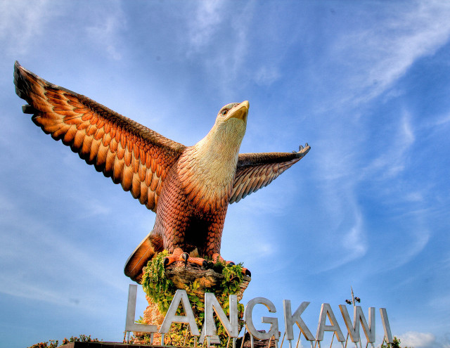Large bird statue building sky free wallpaper for desktop - medium preview image