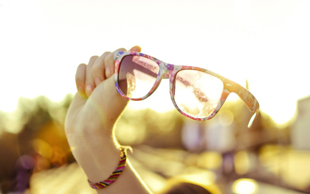 Woman holding glasses sunshine lens free wallpaper for desktop - medium preview image