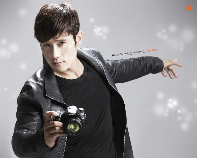 Man holding camera pointing white free wallpaper for desktop - medium preview image