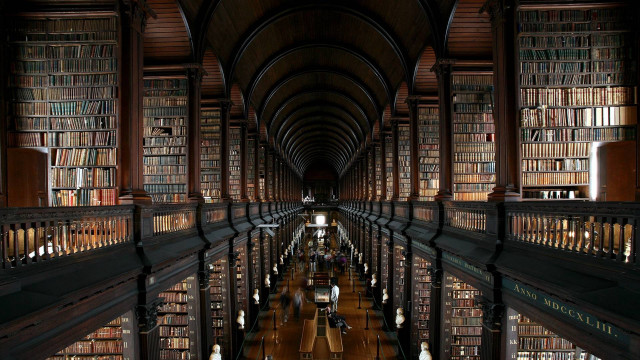 Long library bookshelves people sitting free wallpaper for desktop - medium preview image