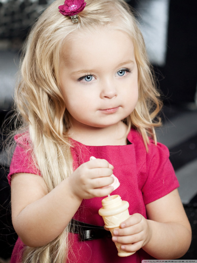 Little girl holding stick food free wallpaper for mobile - medium preview image