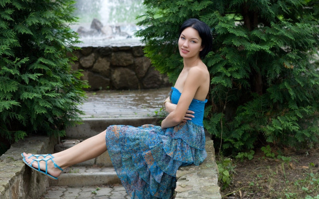 Woman sitting waterfall blue dress free wallpaper for desktop - medium preview image