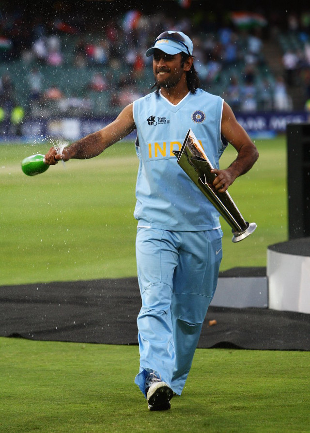 Man blue uniform holding trophy free wallpaper for mobile - medium preview image