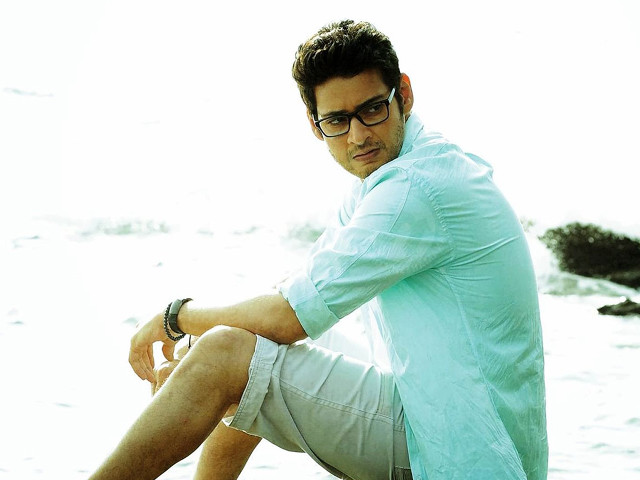 Man sitting rock ocean legs free wallpaper for desktop - medium preview image