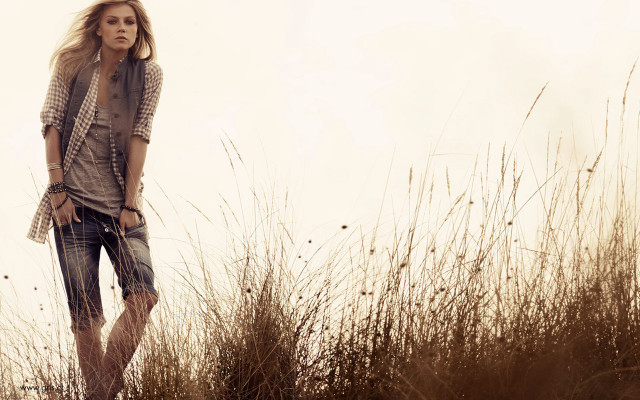 Woman field grass hands pockets free wallpaper for desktop - medium preview image