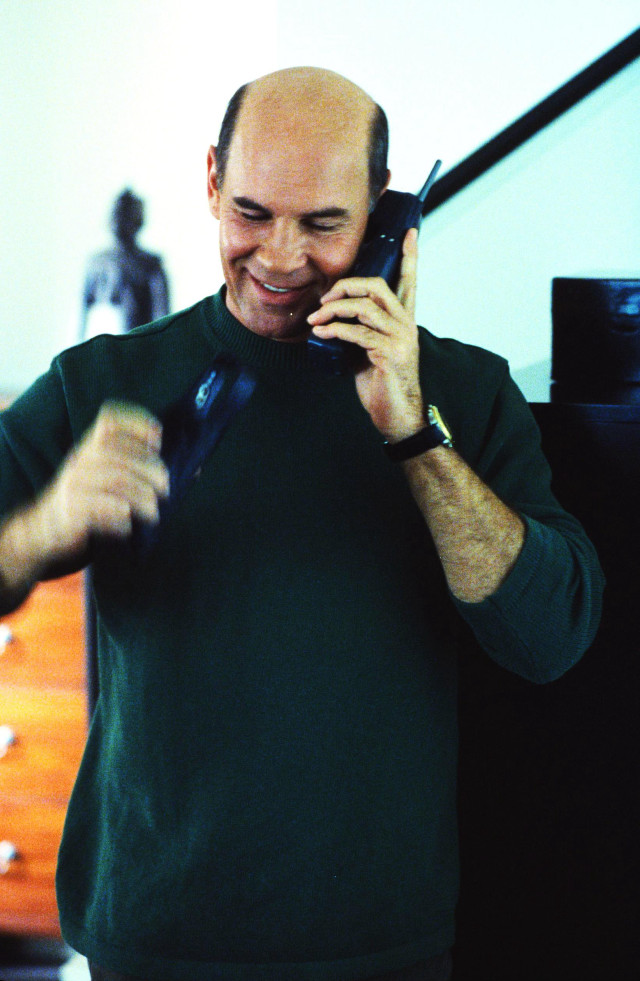 Man talking cell phone room free wallpaper for mobile - medium preview image