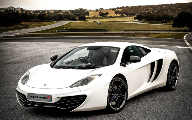 White sports car hill road free wallpaper for desktop - medium preview image