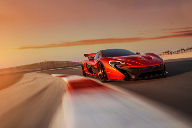 Red sports car driving sunset free wallpaper for desktop - medium preview image