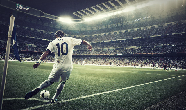 Soccer player kicking ball stadium #2 free wallpaper for desktop - medium preview image