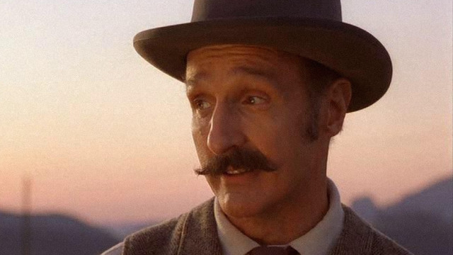 Man mustache hat camera mountain free wallpaper for desktop - medium preview image