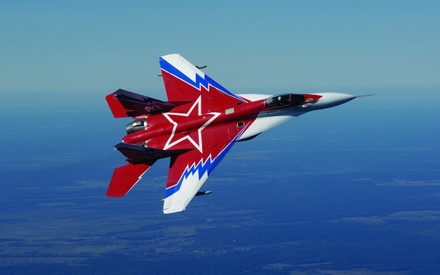 Red white fighter jet flying free wallpaper for desktop - medium preview image