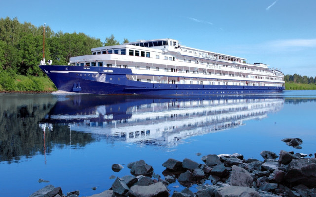 Large boat docked water rocks free wallpaper for desktop - medium preview image
