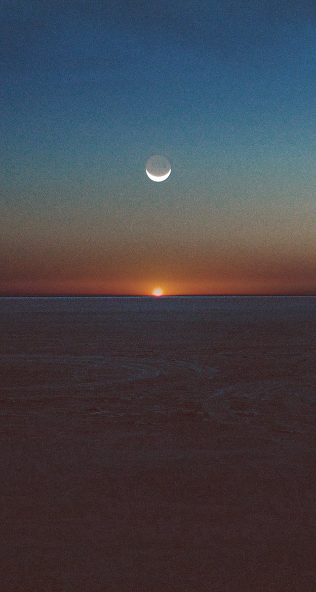 Sunset halfmoon distant moon ocean free wallpaper for mobile - medium preview image