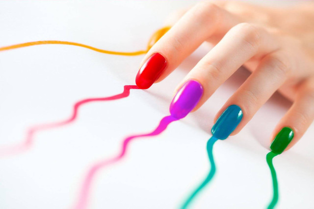 Woman hand multicolored manicure nail free wallpaper for desktop - medium preview image