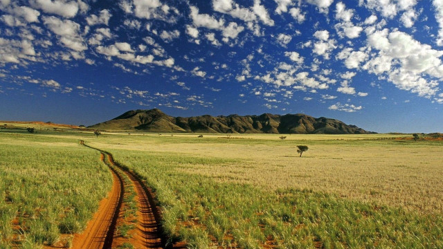 Dirt road field mountains clouds free wallpaper for desktop - medium preview image