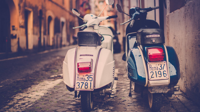 Mopeds parked cobblestone street city free wallpaper for desktop - medium preview image