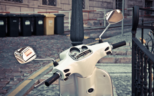 White scooter parked street fence free wallpaper for desktop - medium preview image