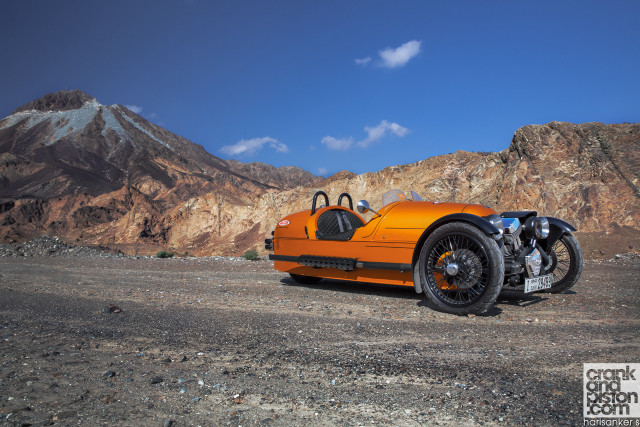 Orange motorcycle mountain range sky free wallpaper for desktop - medium preview image