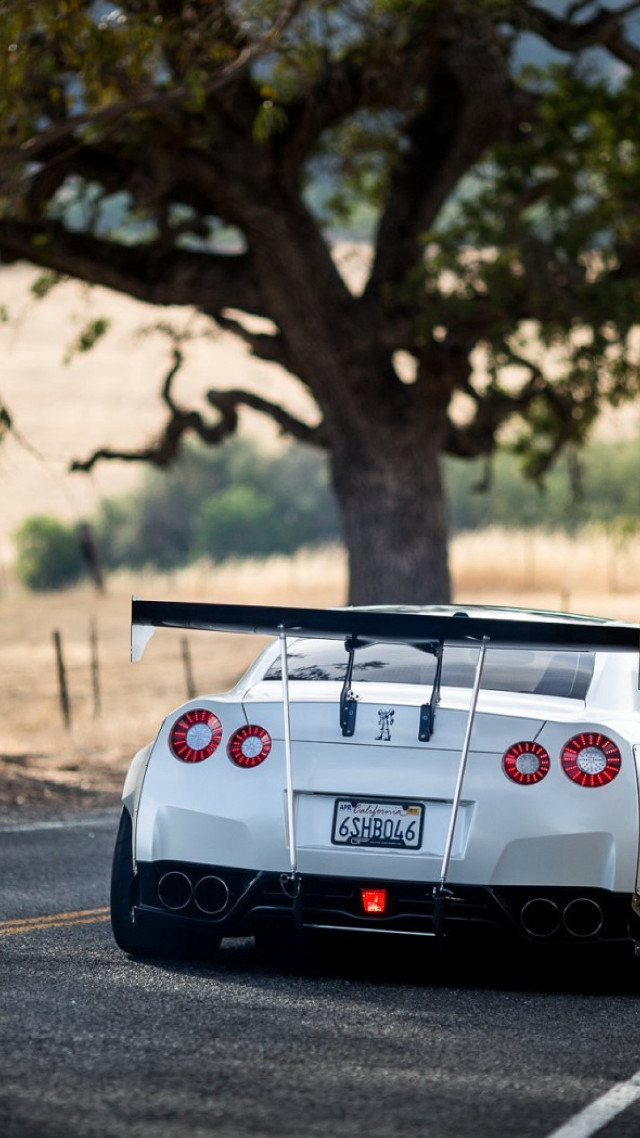 White sports car parked tree free wallpaper for mobile - medium preview image