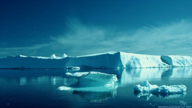 Large iceberg floating ocean distant free wallpaper for desktop - medium preview image