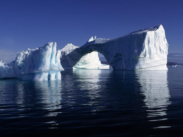 Iceberg ocean shoreline boat blue free wallpaper for desktop - medium preview image