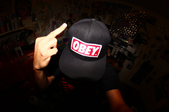 Person hat sticker pointing camera free wallpaper for desktop - medium preview image