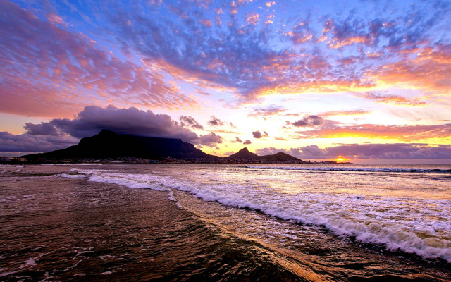 Sunset beach waves mountains clouds free wallpaper for desktop - medium preview image