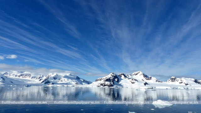 Snowy mountains icebergs blue sky free wallpaper for desktop - medium preview image