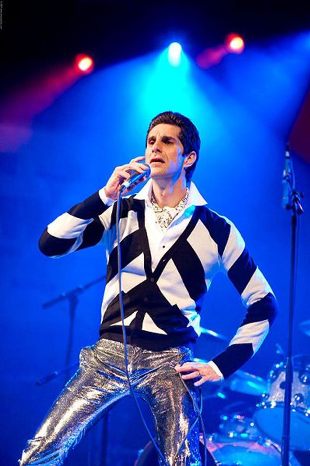 Man striped sweater singing microphone free wallpaper for mobile - medium preview image