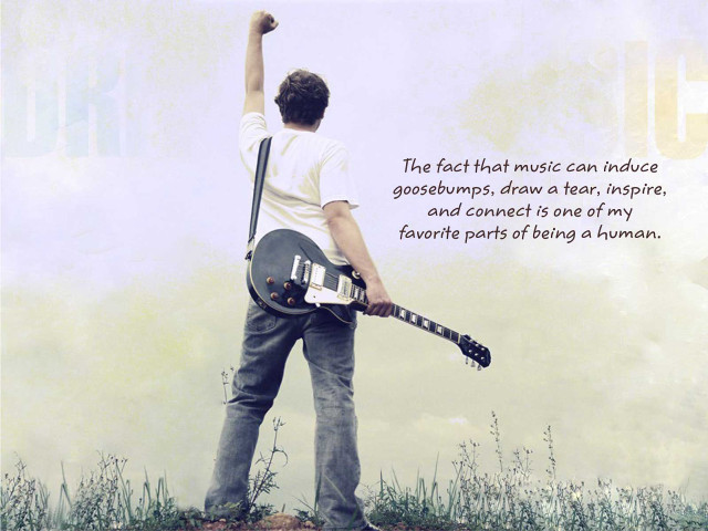 Man holding guitar quote music free wallpaper for desktop - medium preview image