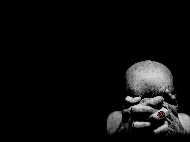 Person holding red object dark free wallpaper for desktop - medium preview image