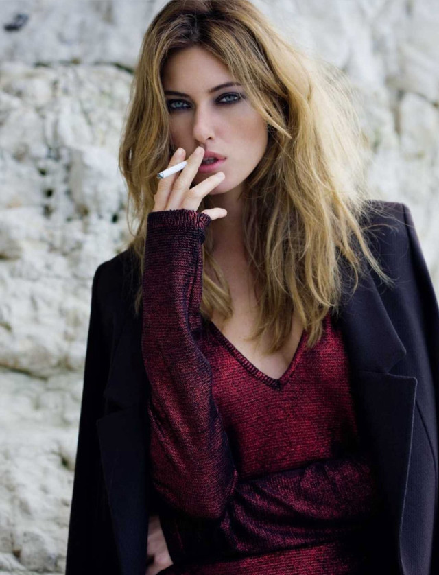 Woman smoking cigarette rock wall free wallpaper for mobile - medium preview image