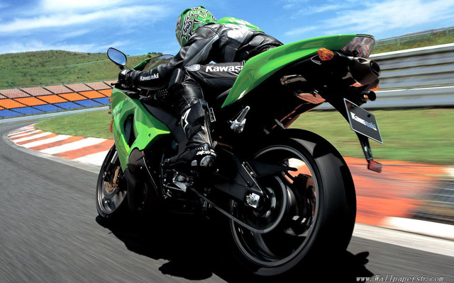 Person riding green motorcycle track free wallpaper for desktop - medium preview image