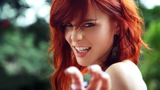 Woman red hair funny face free wallpaper for desktop - medium preview image