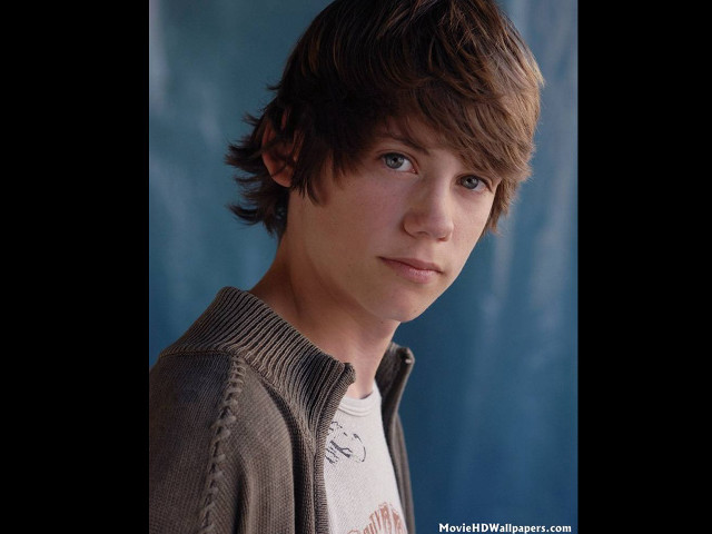 Young man brown jacket white free wallpaper for desktop - medium preview image