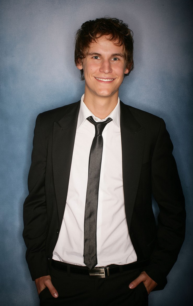 Young man suit tie posing free wallpaper for mobile - medium preview image