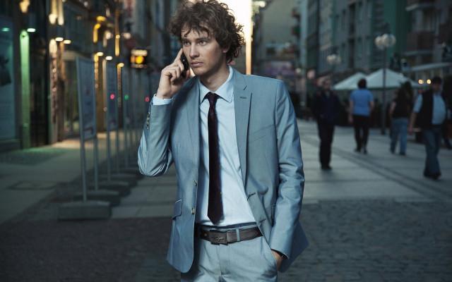 Man suit phone city night free wallpaper for desktop - medium preview image