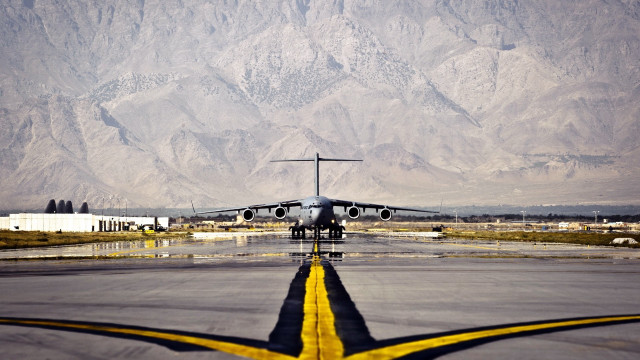 Airplane runway mountains yellow line free wallpaper for desktop - medium preview image