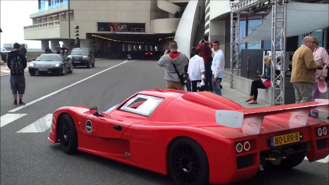 Red race car parked road free wallpaper for desktop - medium preview image