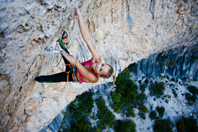 Woman climbing steep cliff rope free wallpaper for desktop - medium preview image