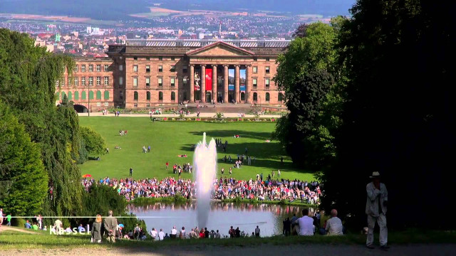 Large building fountain people standing free wallpaper for desktop - medium preview image