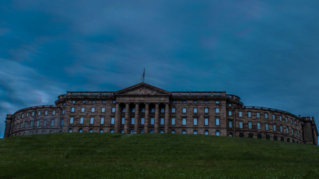 Large building hill sky background free wallpaper for desktop - medium preview image