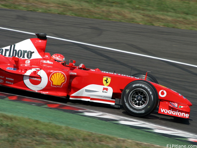 Red race car track grass #3 free wallpaper for desktop - medium preview image