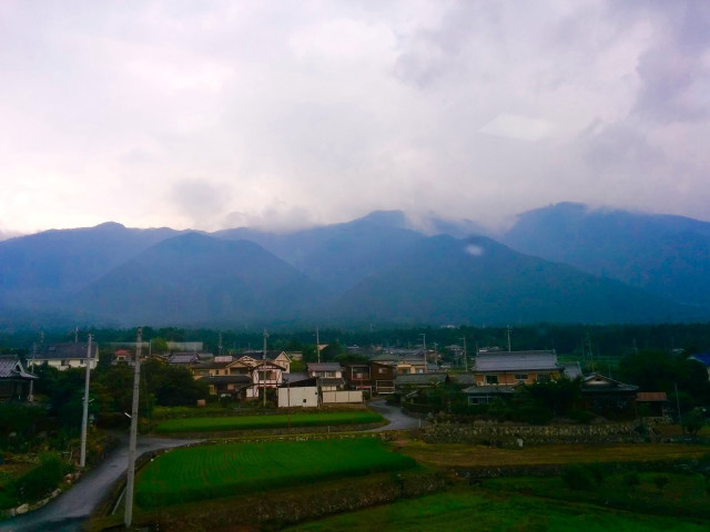 Village mountains cloudy sky background free wallpaper for desktop - medium preview image