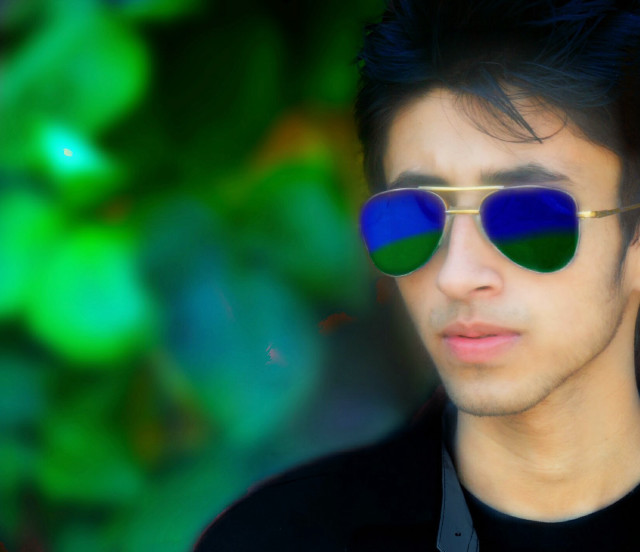 Man sunglasses green blue background free wallpaper for desktop - medium preview image