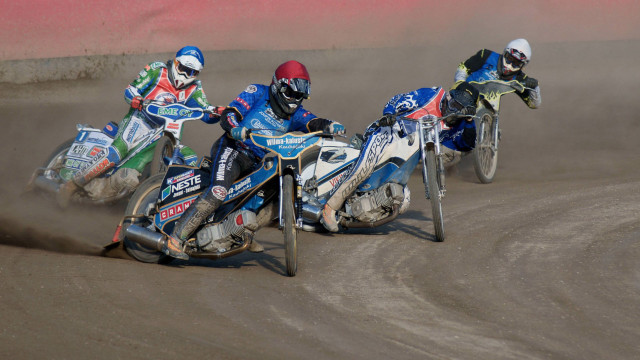 Motorcyclists racing dirt track dust free wallpaper for desktop - medium preview image