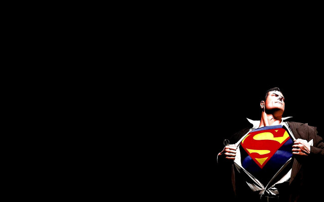 Man holding superman symbol looking #3 free wallpaper for desktop - medium preview image